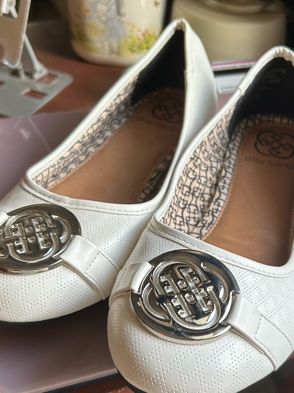 Daisy Fuentes White Slip-On Ballet Flats with Silver Emblem